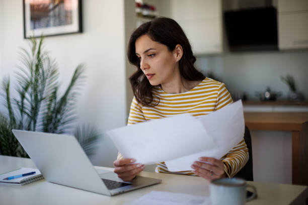 woman filling out an application.| what documents do I need for a China visa?