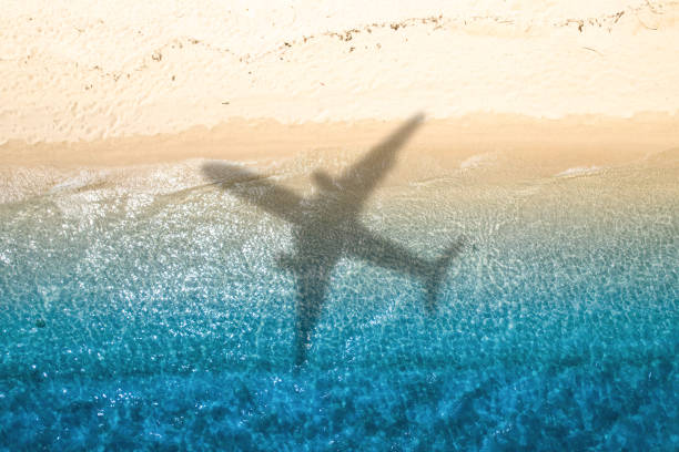 plane flying over water.\\ mail in china Visa application
